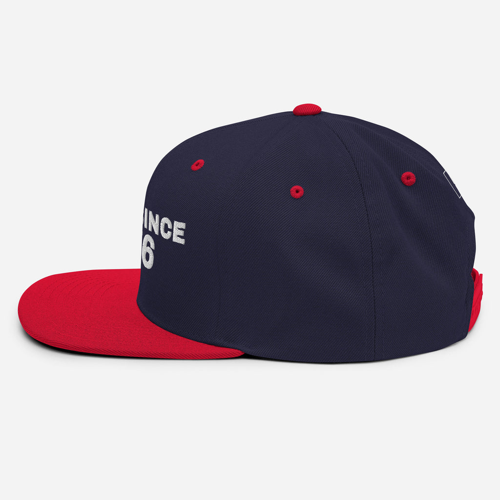 Navy and red snapback cap with USA GREAT SINCE 1776 embroidery