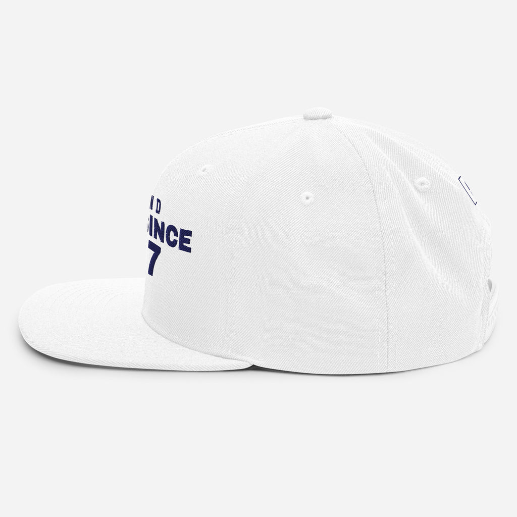 White snapback cap with FINLAND GREAT SINCE 1917 embroidery